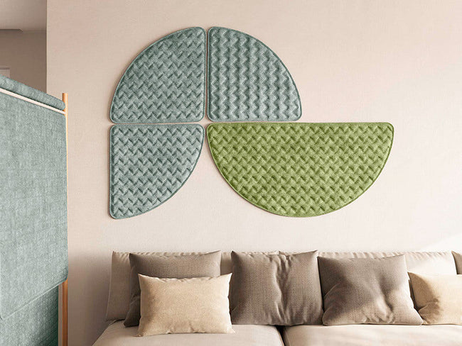 MIO Culture Quiltforms acoustic art panels in green and grey above a sofa.