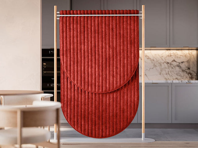 Red freestanding acoustic partition wall with curved design in modern kitchen