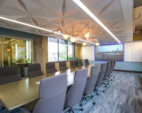 decorative ceiling tiles in a modern conference room with pendants