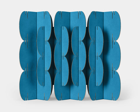 Nomad System room divider with 26 cyan cardboard modules creating a refreshing and modern space partition