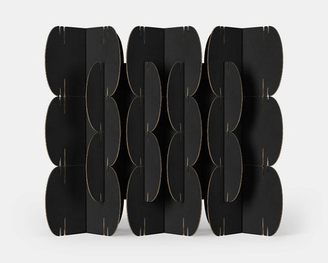 Nomad System room divider with 26 grey cardboard modules arranged in a sophisticated contemporary pattern