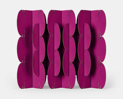 Mio Culture Nomad System with 26 magenta cardboard modules forming a striking contemporary room divider