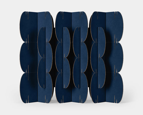 Mio Culture Nomad System featuring 26 navy blue cardboard modules arranged in an elegant contemporary pattern