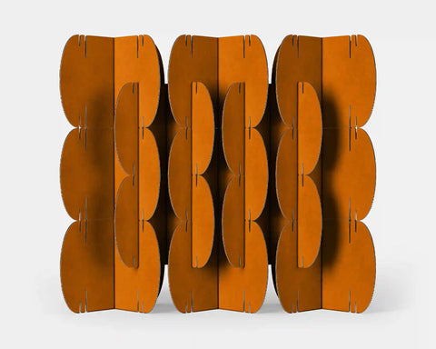 Mio Culture Nomad System modular room divider featuring 26 orange cardboard modules arranged in a geometric pattern