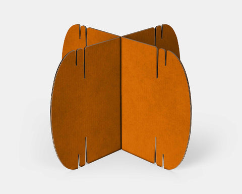 Two orange Nomad System cardboard modules displaying the bright color option and interlocking design features