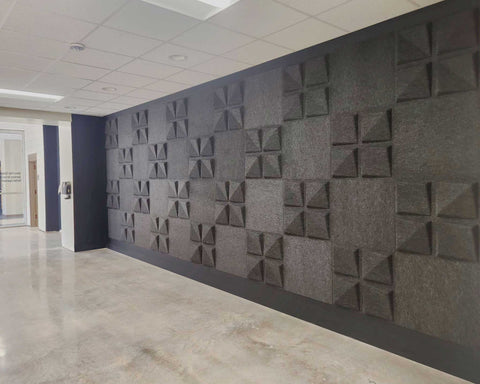 Edge FeltForms Acoustic Tiles creating a decorative accent wall in Quad arrangement