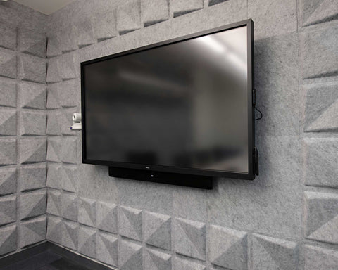 FeltForms Acoustic Tiles in Quad arrangement surrounding TV in meeting room