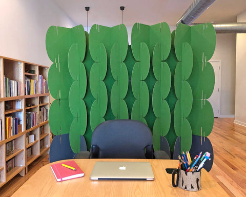 Close-up view of Nomad System room divider in a home office showcasing detailed modular construction and texture