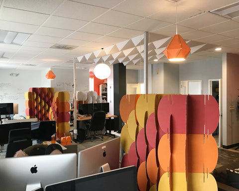 Nomad System cardboard room divider in a sculptural foldscape configuration showcasing artistic installation potential