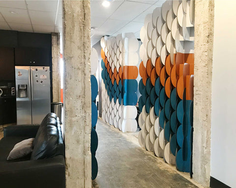 Alternative view of Nomad System room divider in a hallway setting showing versatile application for transitional spaces