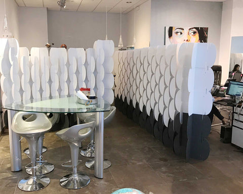 Nomad System cardboard room dividers implemented as office screens for workspace division and privacy