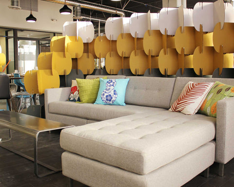 Nomad System cardboard room divider creating a defined social area within an open-plan office environment