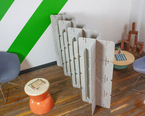 Nomad System felt room dividers arranged to form private acoustic coves for collaborative workspaces