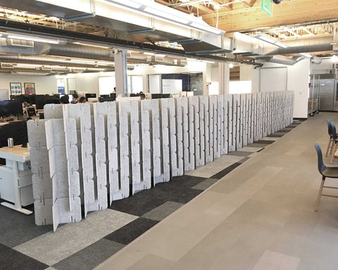 Nomad System Felt PRO Acoustic Room Divider arranged as a long continuous wall in an open office space