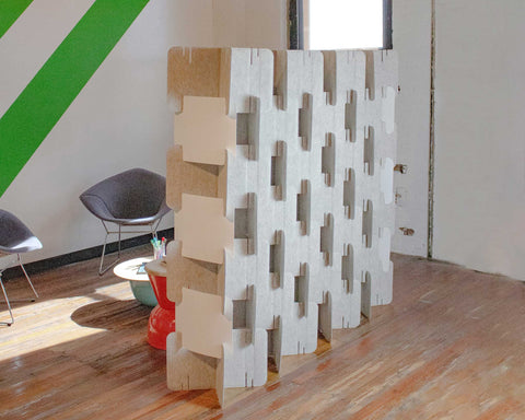 Open assembly of Nomad System felt divider showing modular construction in contemporary breakout area