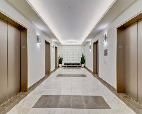 Cube Plasticforms Wall Tiles - White tiles in elevator lobby