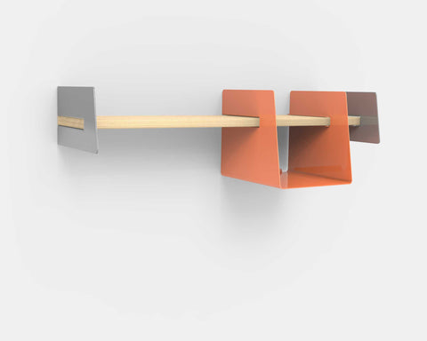 Wall-mounted shelf with orange storage bin