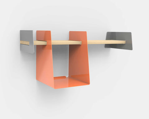 Wall-mounted shelf with orange storage bin