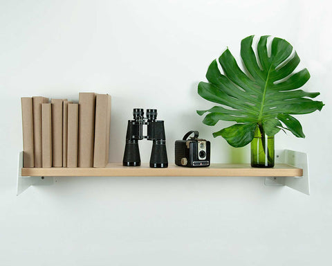 decorative bookshelf with leave and books