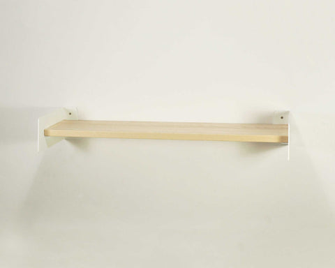 Wooden shelf mounted on a white wall