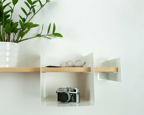 wooden shelf with metal cubbie