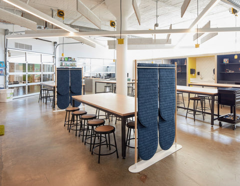 Acoustic felt room divider at maker space