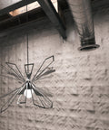 Silver Bendant Lamp with Fractals wallpaper behind.