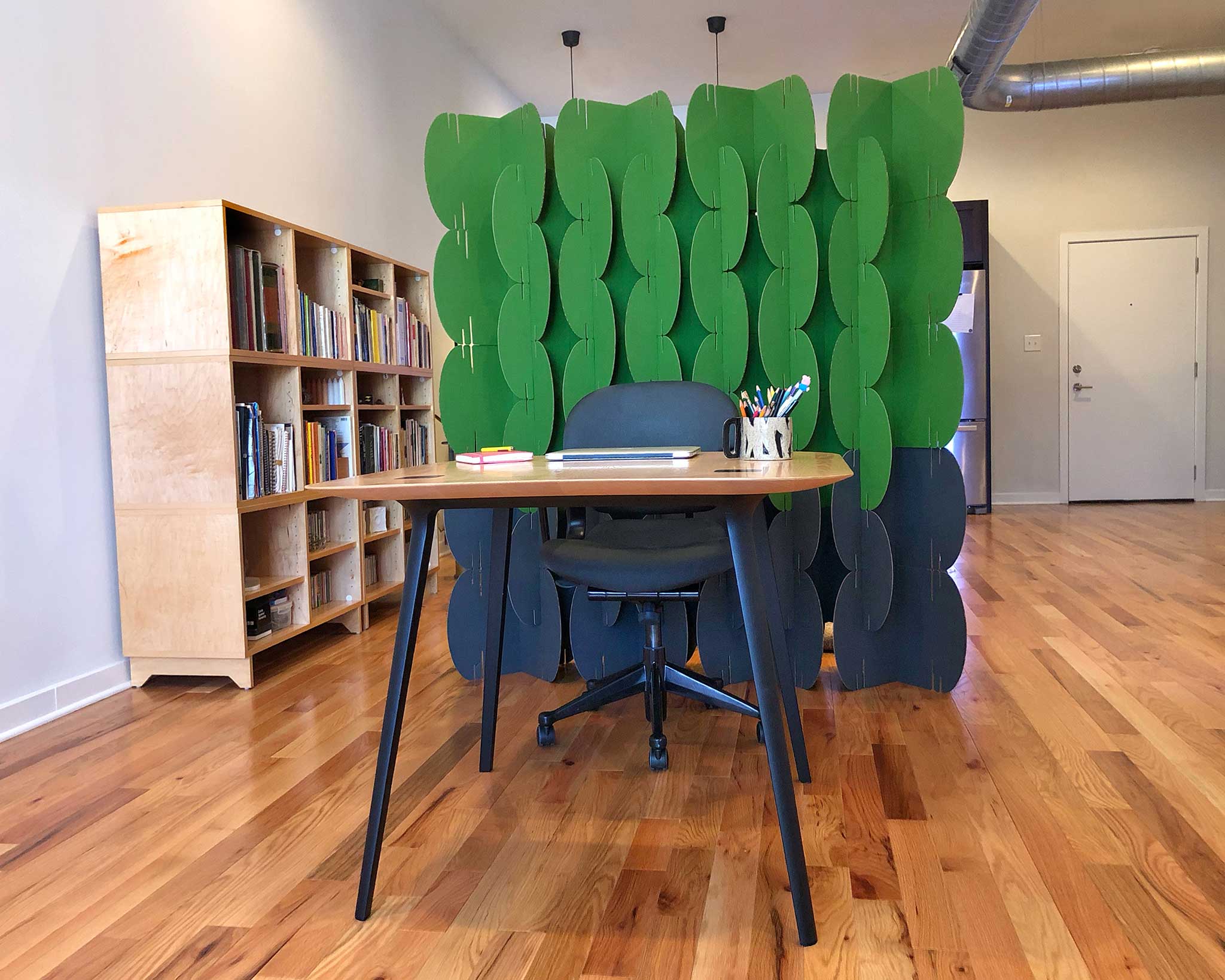Nomad System room divider installed in a home office setting providing stylish workspace separation and privacy