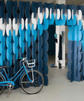 Nomad System room divider with elegant wave pattern creating a modern partition wall for versatile space division