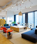 Nomad System felt room divider creating a private breakout meeting space in open office environment with sound absorption