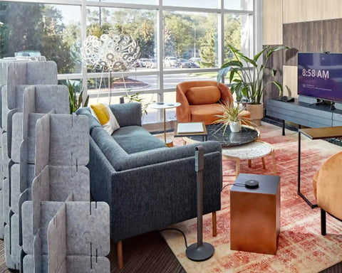 Nomad System felt room divider installed in modern living area providing elegant space division with soft textile finish