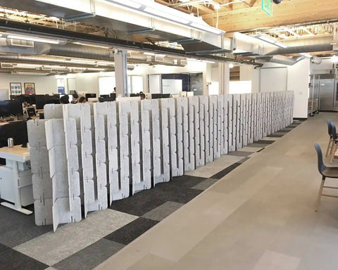 Nomad System Felt PRO Acoustic Room Divider arranged as a long continuous wall in an open office space