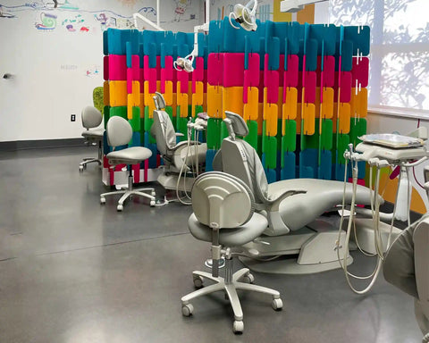 Mio Sled portable room divider screen installed in dentist office for patient privacy