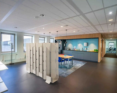 Mio Sled portable room divider screen installed in kitchen area creating separate dining space