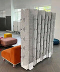 Mio Sled portable room divider used as office screen creating private workspace