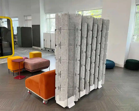 Mio Sled portable room divider used as office screen creating private workspace