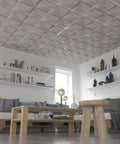 Quad FeltForms 2' x 2' Acoustic ceiling tiles in mottled white installed in a living room with shelves.